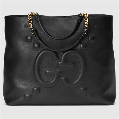 gucci embossed leather tote bag.